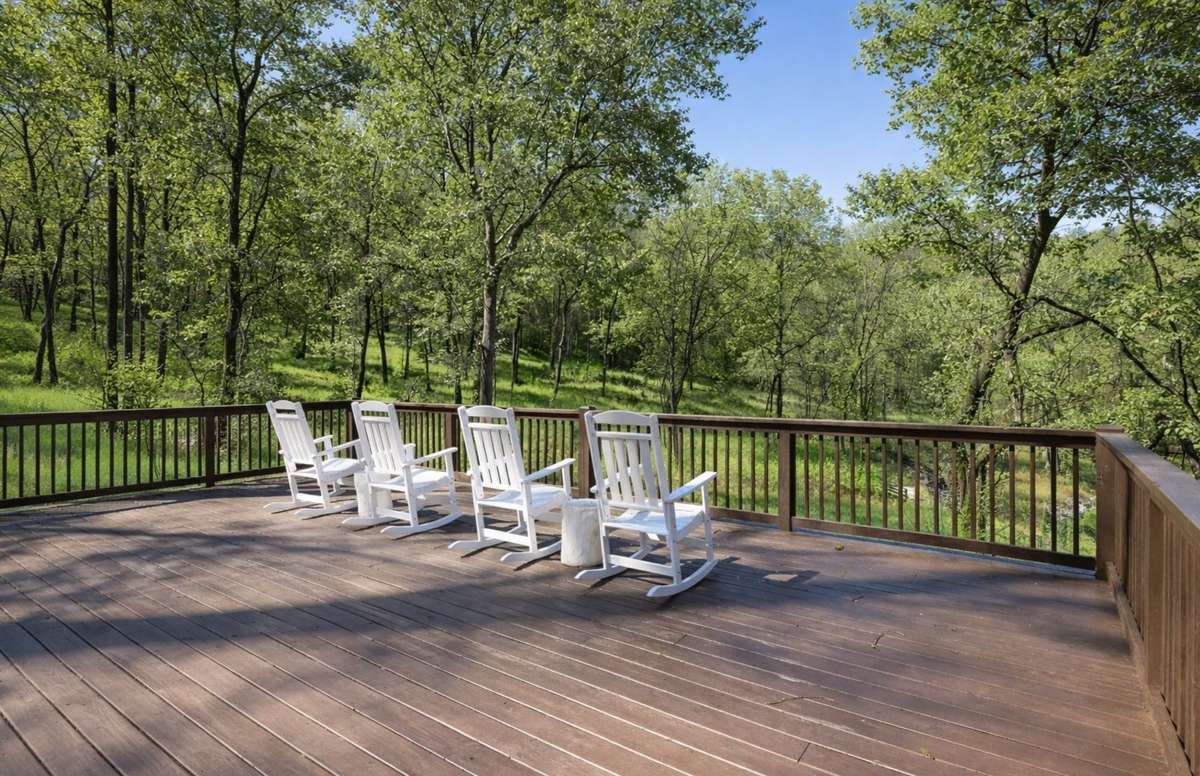 Elevated outdoor living space overlooking the pond