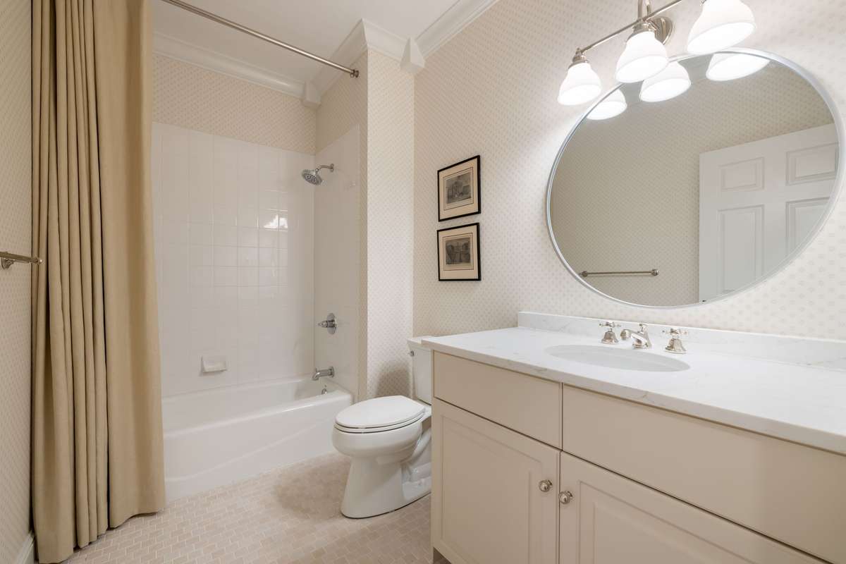 Lower-level bathroom with clean finishes and convenient access to adjacent living spaces