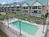 Please note the exterior has been recently updated with a modern white brick and overlooks this beautiful salt water pool.