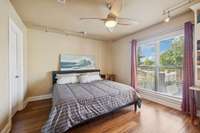 Guest bedroom with large double windows for natural light