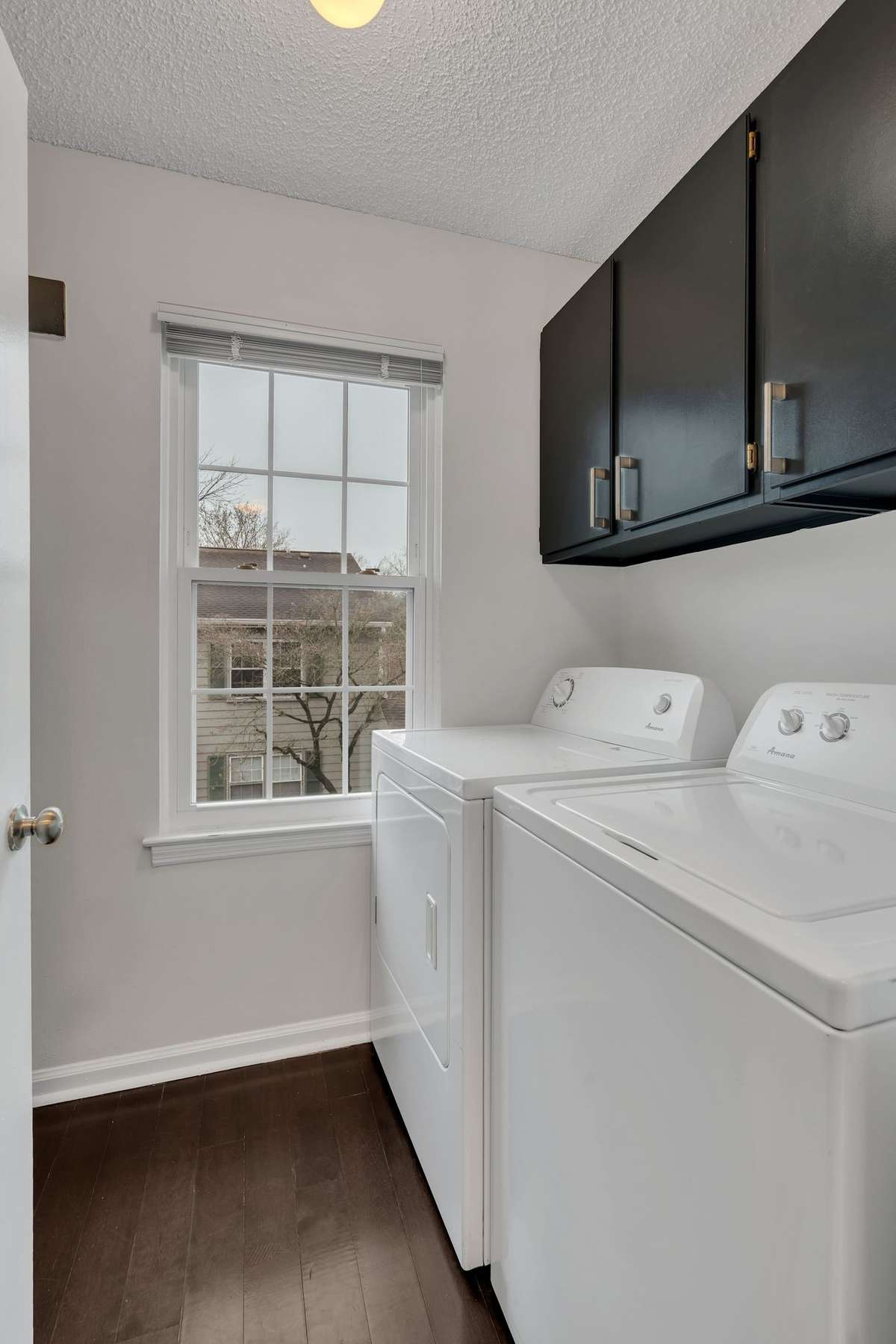 large laundry room with built ins for ample storage