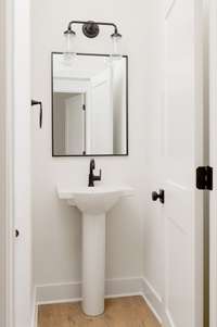 Half bath off living room *Photo not of actual home- construction to begin soon!!*