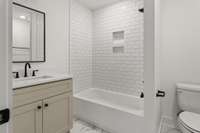 First floor bedroom with full bathroom *Photo not of actual home- construction to begin soon!!*