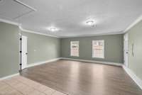 A pedestrian door provides exterior access, and a spacious walk-in storage closet adds incredible everyday convenience.