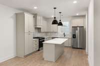 Beautiful kitchen layout with same cabinet and backsplash colors as our model!