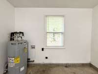Hot Water Heater and Laundry Hookups located in the Attached Garage. Hot Water Heater purchased in 2024