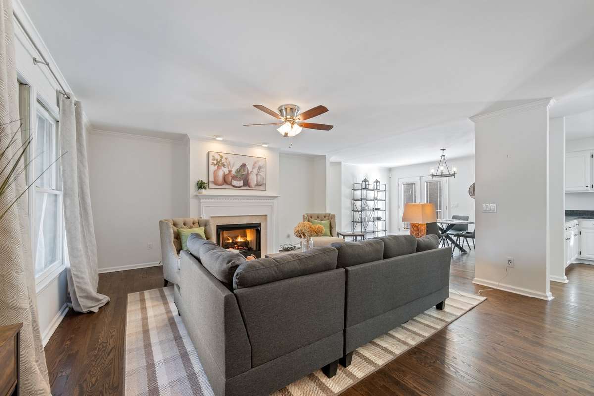 LARGE LIVING ROOM with gleaming original hardwood floors
