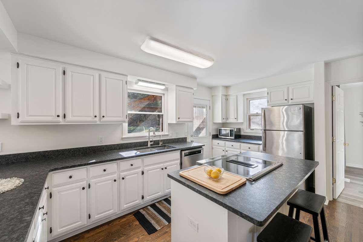 updated kitchen with newer ss appliances.    kitchen aid range, GE fridge