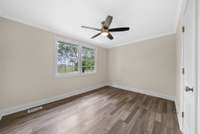 Another spacious room (or bedroom 5) on main level with large closet.