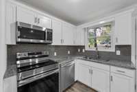 Newer cabinetry, newer appliances, newer granite tops, fresh & move-in ready.