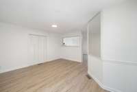 This space offers a spacious, open layout with durable luxury vinyl plank flooring and fresh neutral paint. Recessed lighting and clean trim create a bright, modern feel.