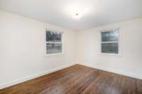 Spacious, Bedroom with windows that bring in great natural light, creating a bright and comfortable retreat with a clean, modern feel.