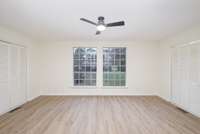 Bedroom space has 2 large windows bring in great natural light & backyard views, while dual closets provide ample storage.