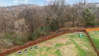 Aerial view... yard backs up to the wooded common area for added privacy