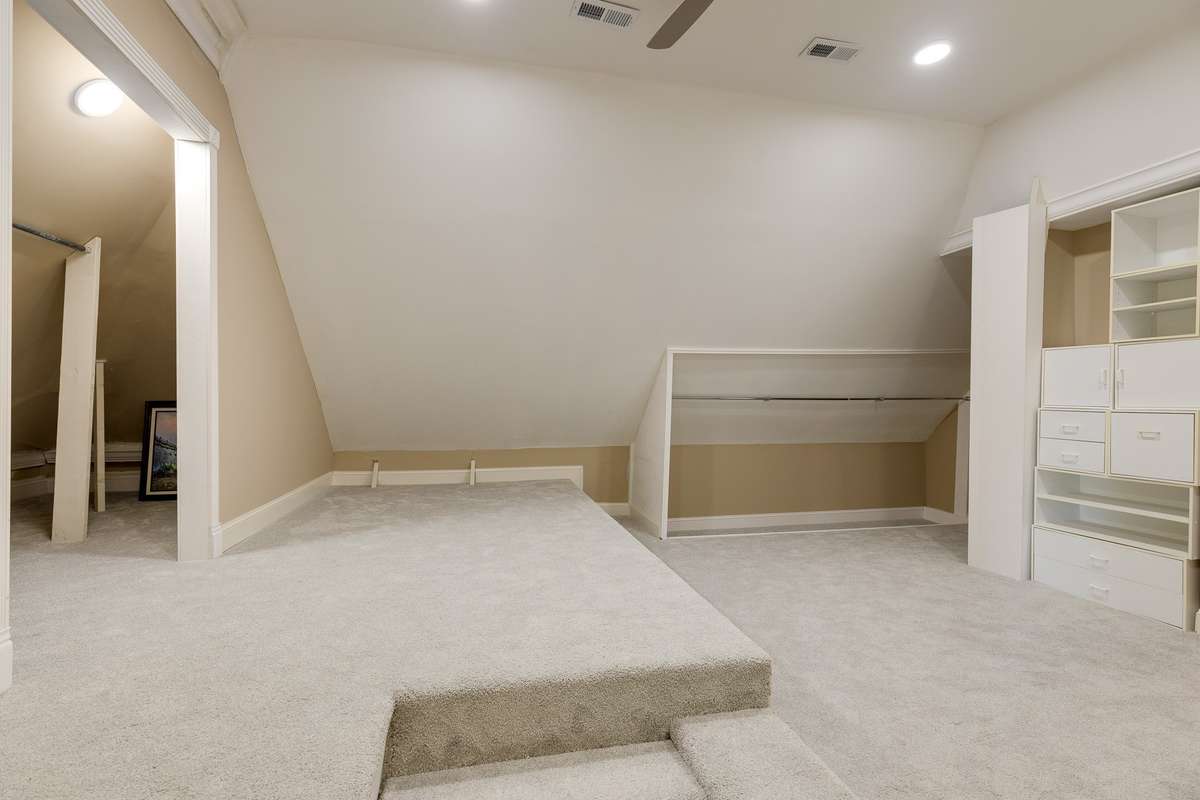 playroom/health and wellness room/media room with attached full bathroom