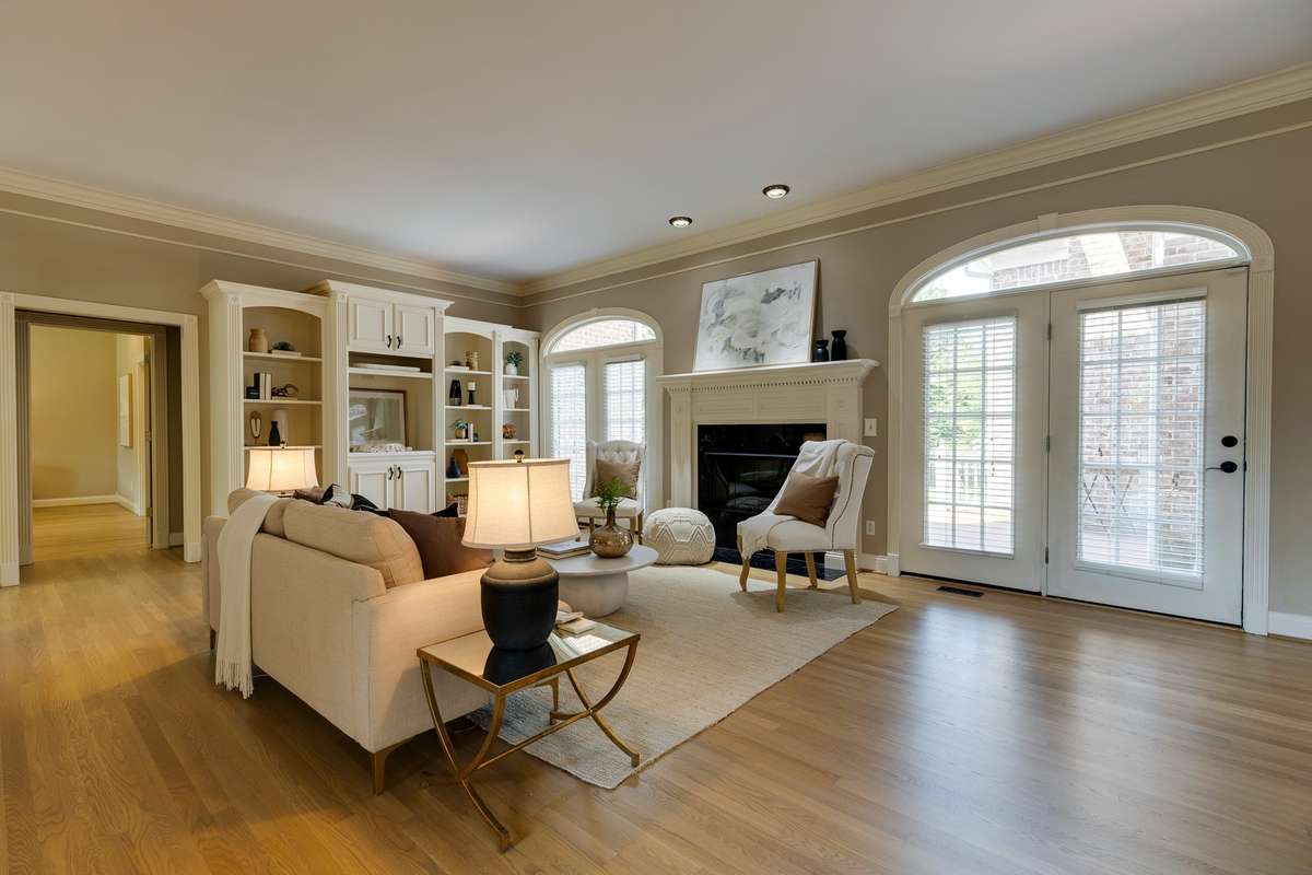 Family room?Den with fireplace and door open to deck