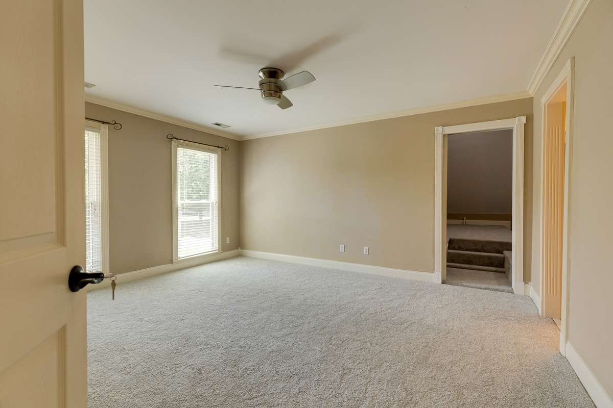 Bedroom 2 upstairs with attached playroom/health and wellness /media room