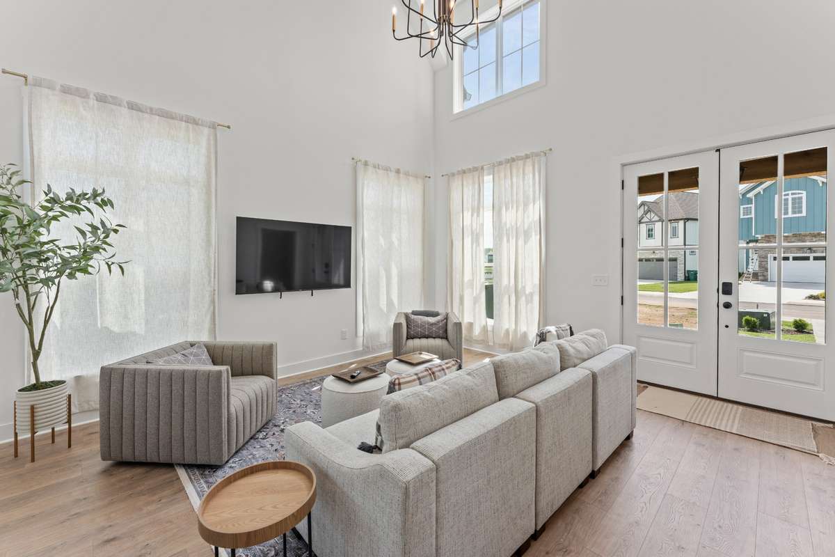 Soaring two-story living area with abundant natural light.