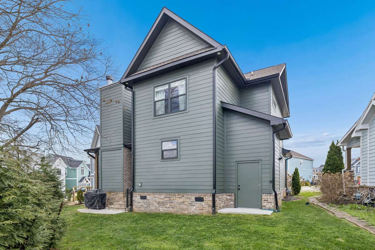 Door to the right opens to a convenient storage area for water toys and the tankless hot water heater