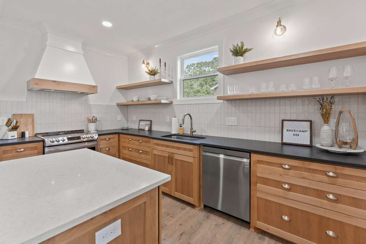 Quartz countertops, Gas cooktop and vented hood