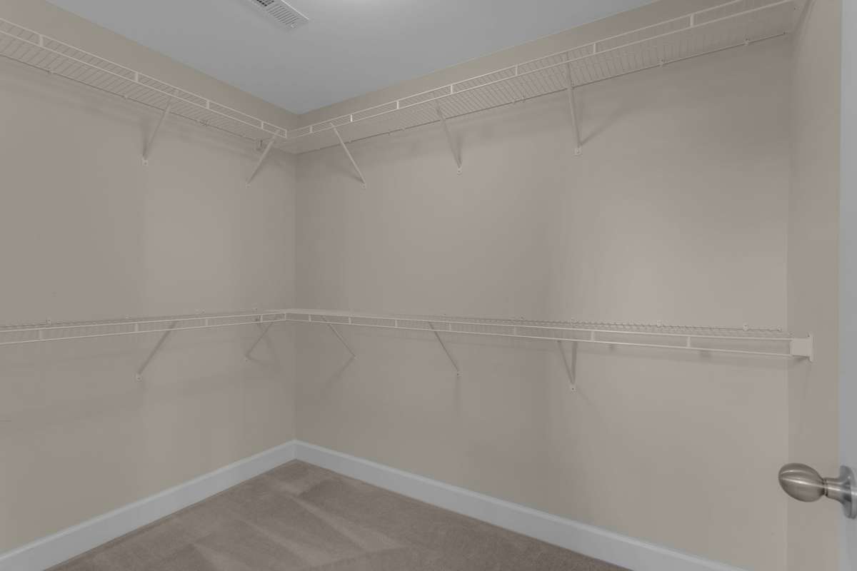 Primary bedroom walk-in closet.