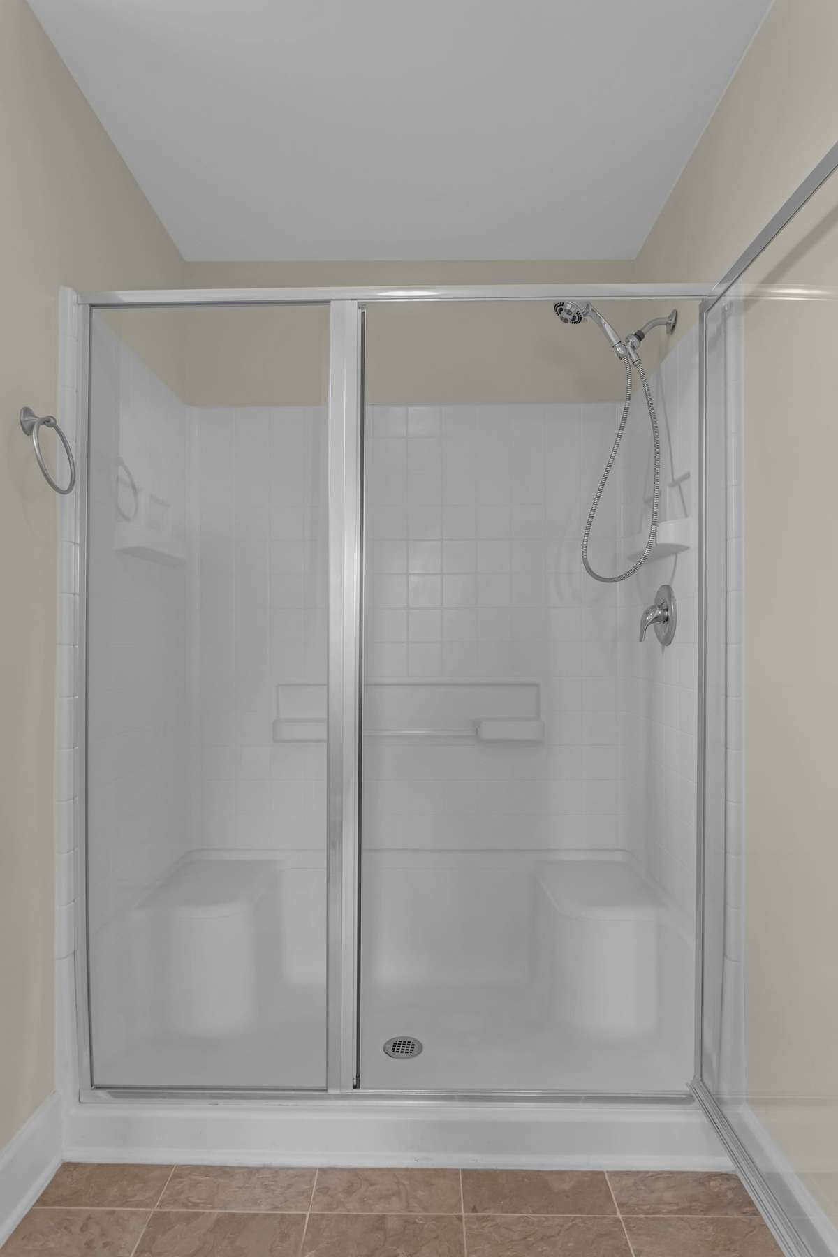 Primary bedroom walk-in shower.