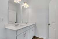 Dual vanities in owner's suite