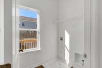 Bright walk in laundry room