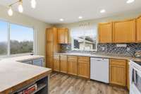 Open layout connecting kitchen and den for seamless entertaining.