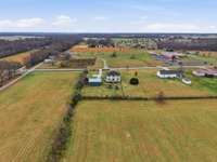 Enjoy the peace and freedom of the countryside with almost one acre of level land.