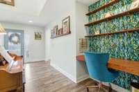 Natural light pours in, offering a warm, inviting atmosphere perfect for greeting guests. This lovely space is both impressive and functional, offering a beautiful transition into the home.