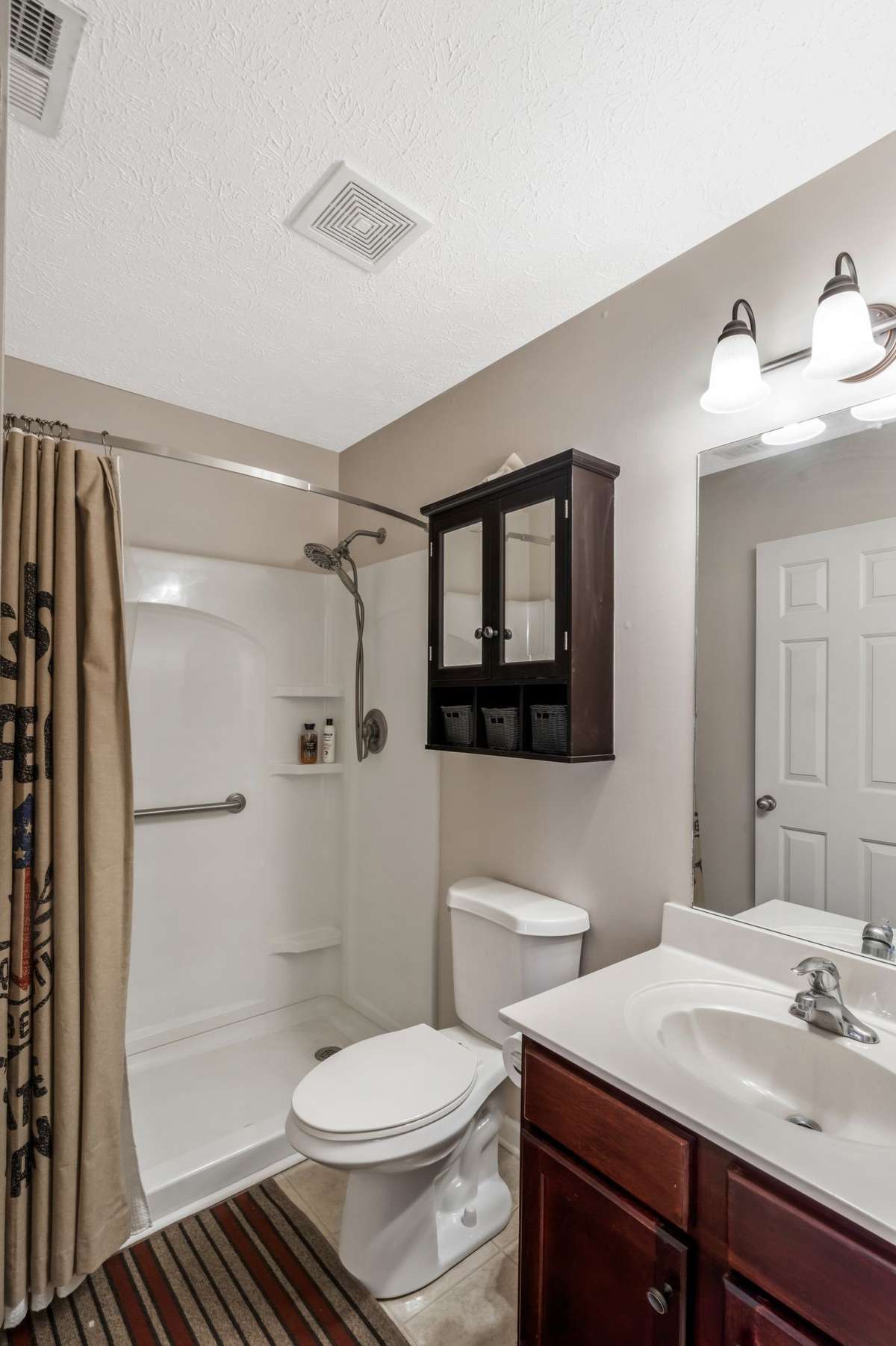 Secondary bathroom with walk-in shower...