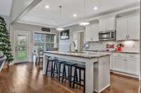 Large Island with plenty of seating. Beautiful hardwood floors.