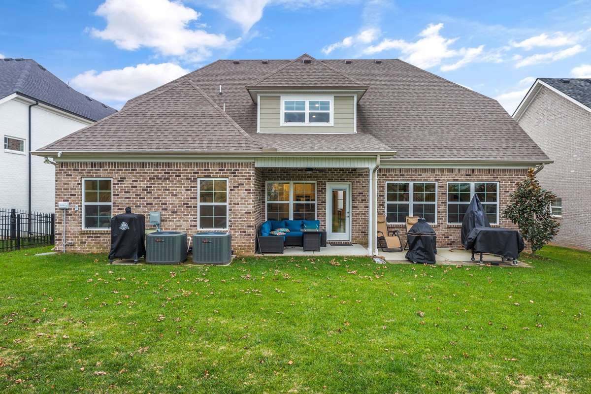 Covered patio and extended concrete for grilling and entertaining.
