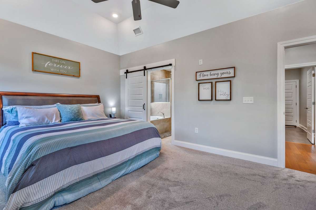Barn door for privacy leads to Primary Bath.