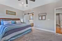 Barn door for privacy leads to Primary Bath.