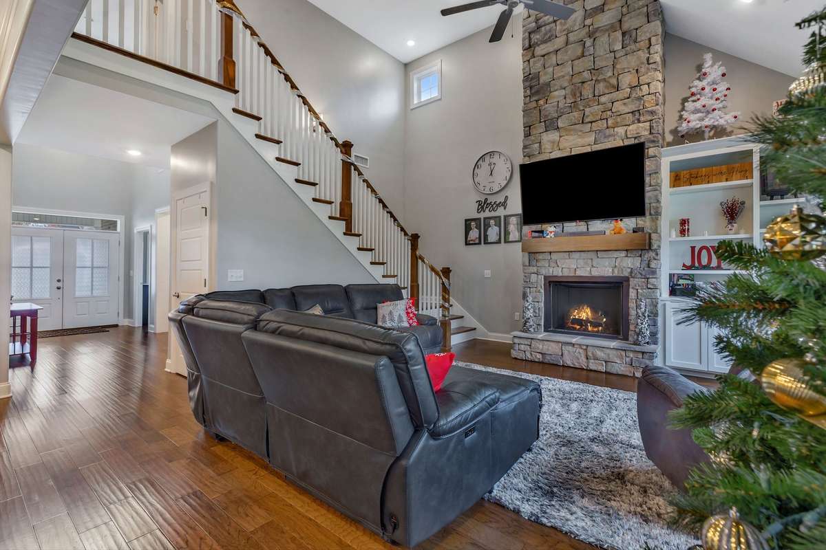 Soaring Stone Fireplace with gas logs.