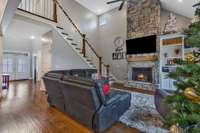 Soaring Stone Fireplace with gas logs.