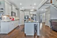 Corner pantry in Kitchen and extra pantry under the stairs for even more storage.