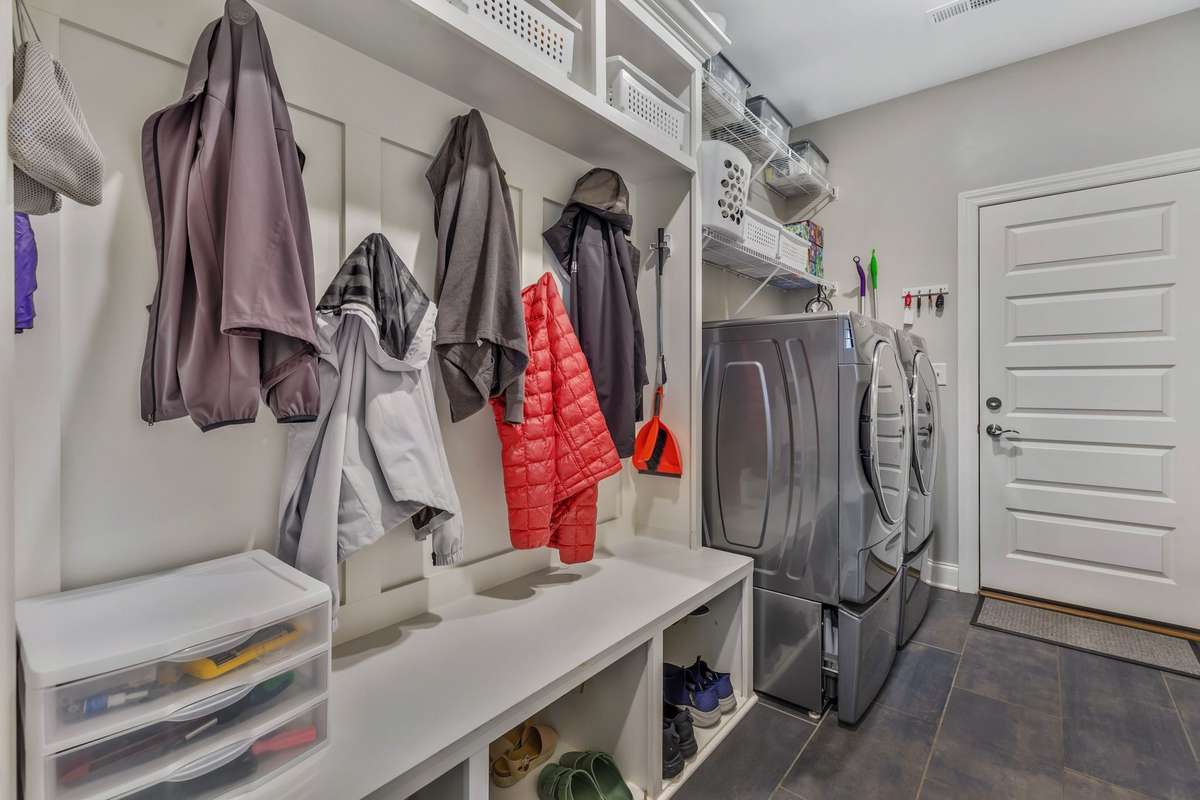 Large Laundry Room with cubbies and hooks.