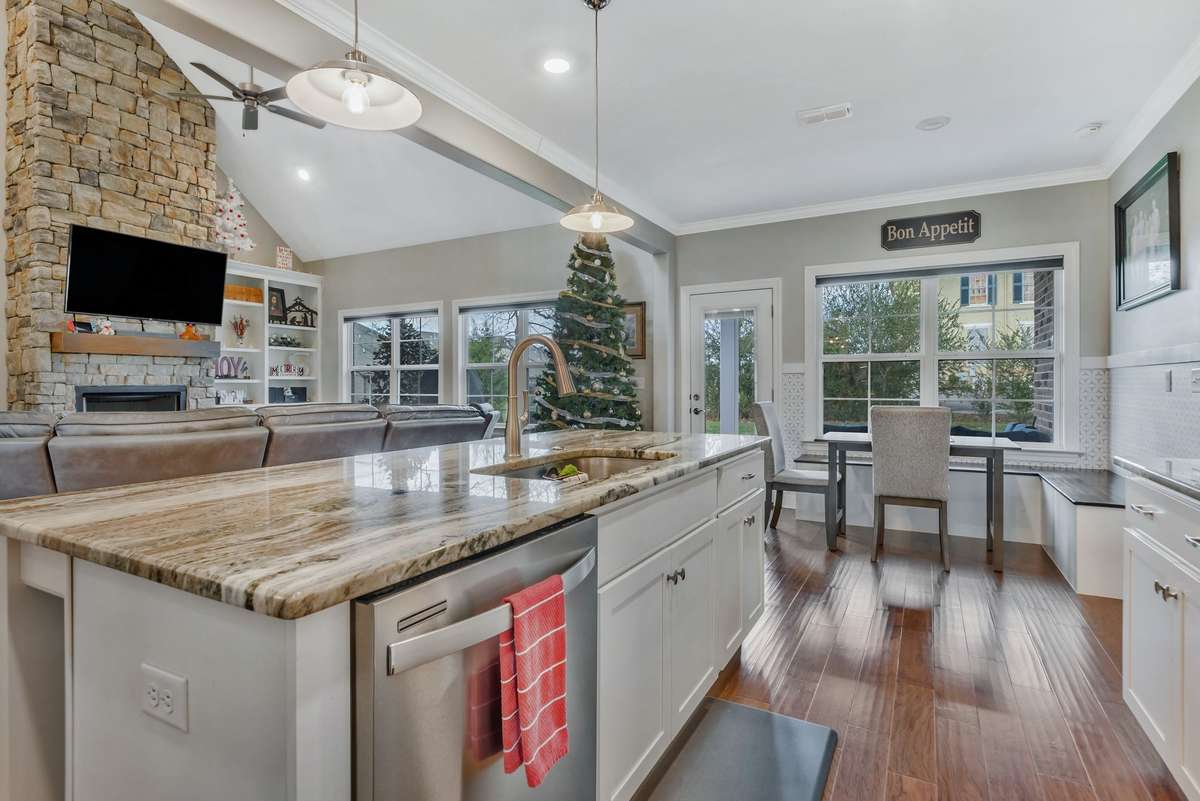 Just a gorgeous view of this open floor plan. Wash dishes while enjoying time with family and watching tv.