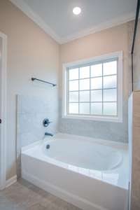 EXAMPLE>>>Soaker Tub with a Frosted Window and Tile Surrounding! Perfect to Relax in After a Long Day!
