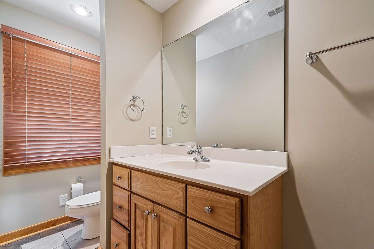 The upstairs bathroom has tile floors.