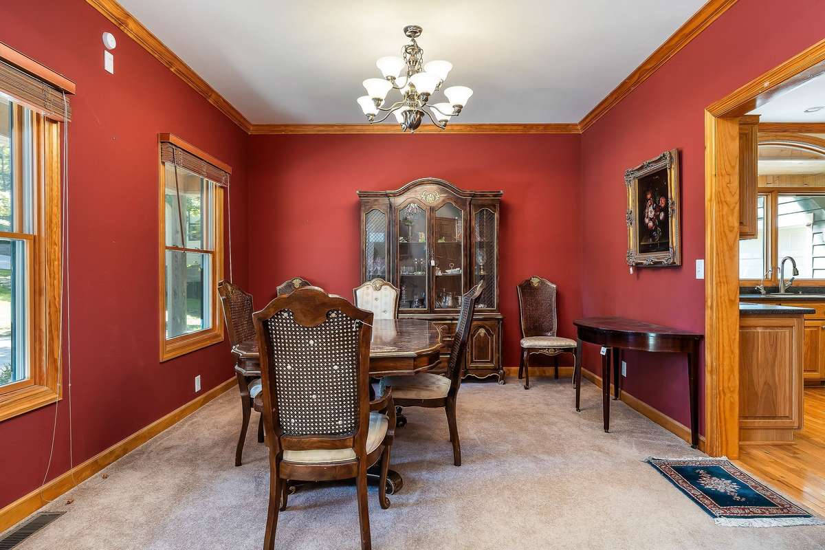 The dining room is located beside the entrance to the kitchen.