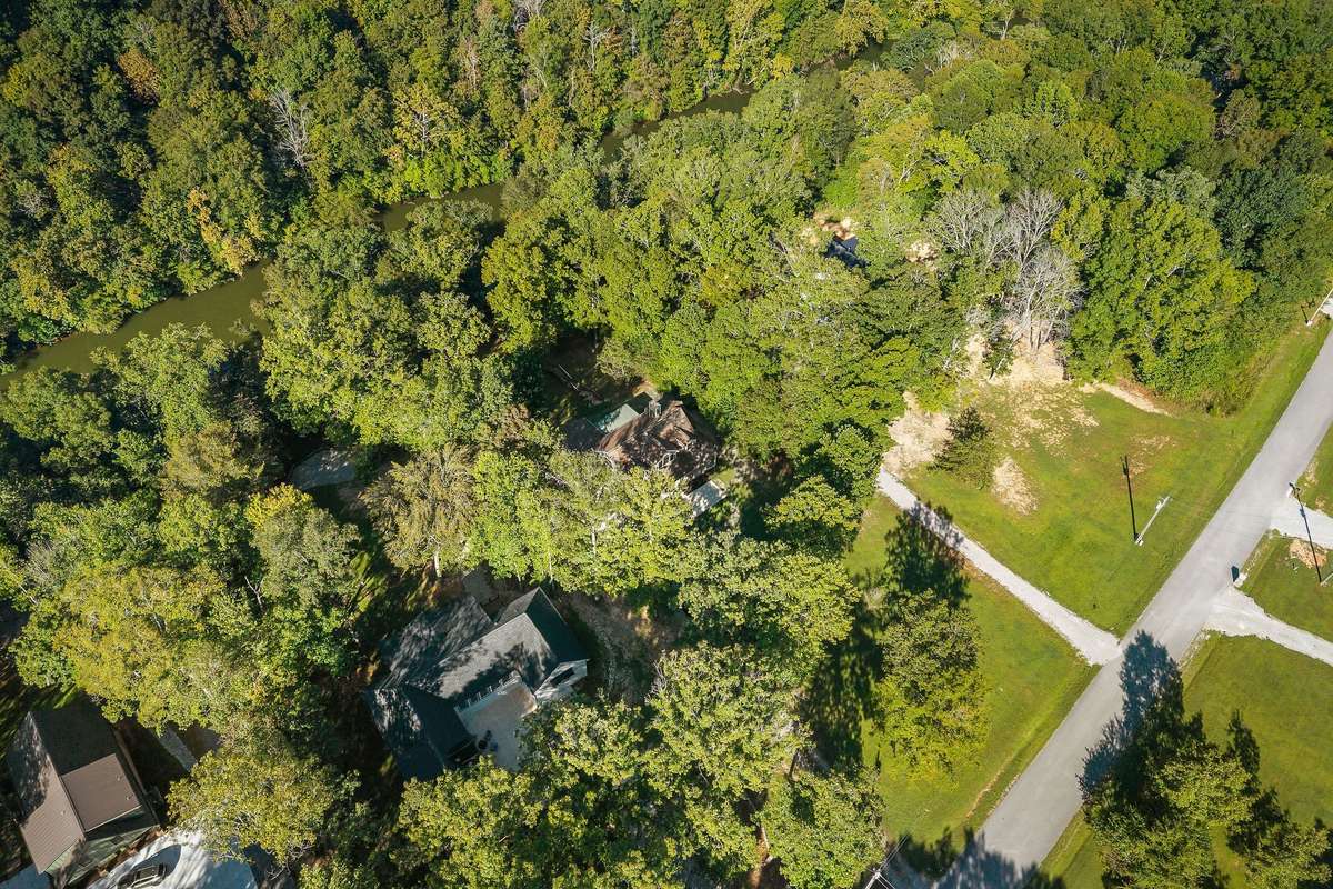Notice the Rocky River at the back of the home.
