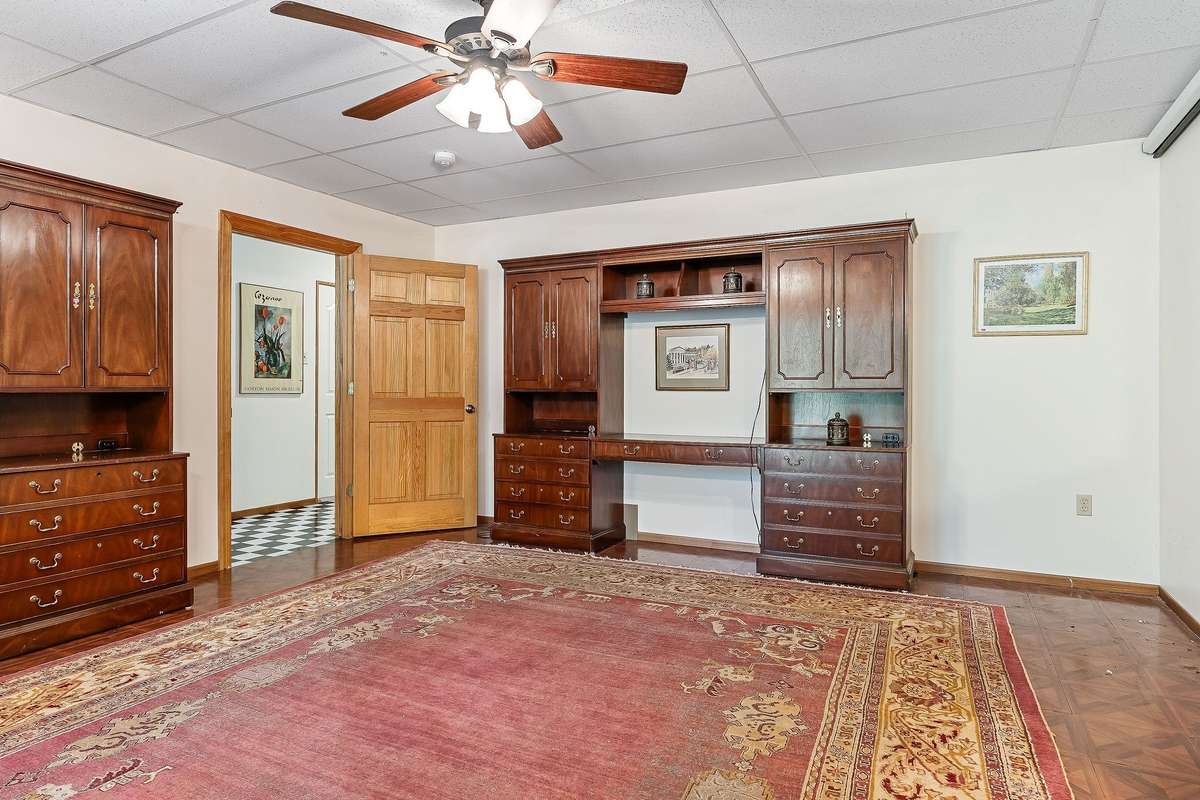 The large den is downstairs.  It has access to the back covered patio and a walk to the river.