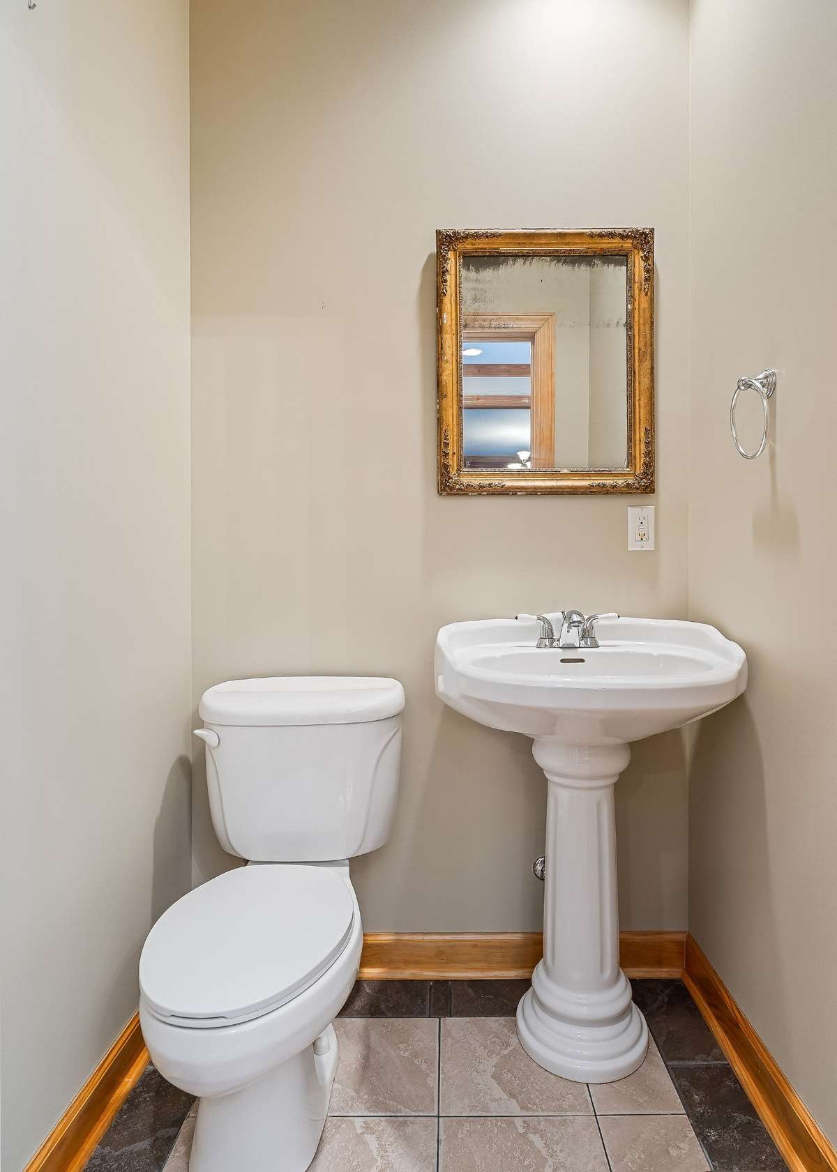 The guest bathroom is conveniently located off the foyer.