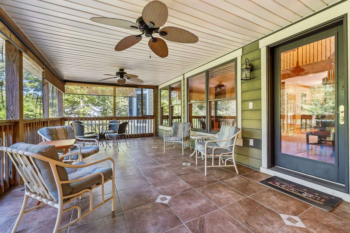The sellers added a massive screened-in porch to the back of the home in 2013.  It features tile, ceiling fans, and a fabulous space to relax with family and friends while enjoying the breathtaking view of the Rocky River.