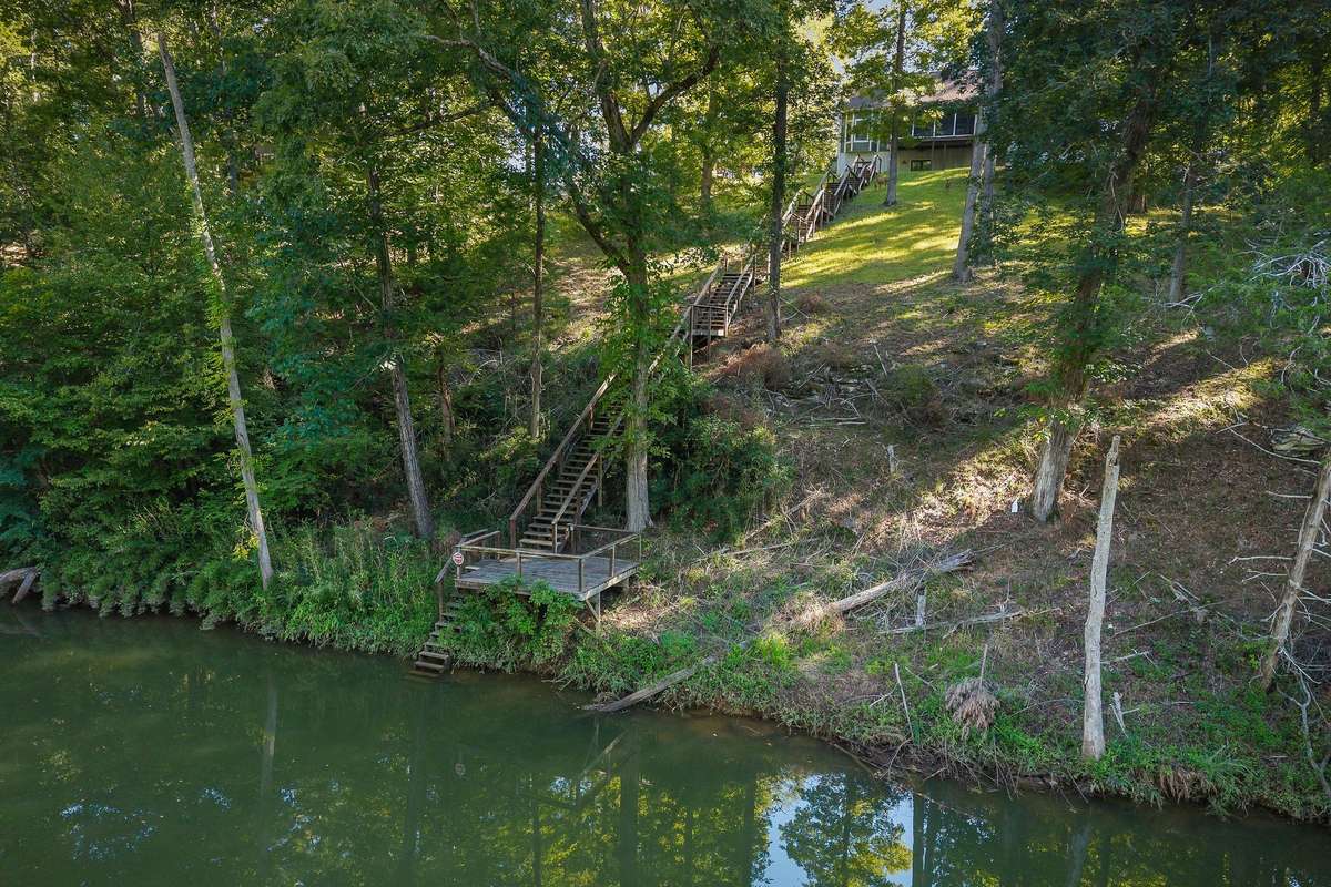 View of the steps and backyard leading to the river.