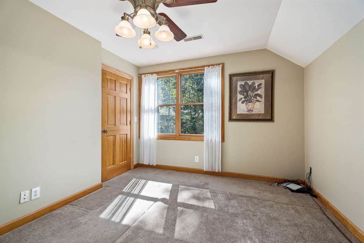 The second upstairs bedroom also features a large window which adds natural light.